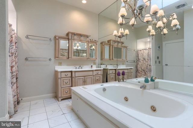 bathroom with a notable chandelier, vanity, and separate shower and tub