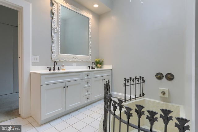 bathroom with tile patterned flooring and vanity