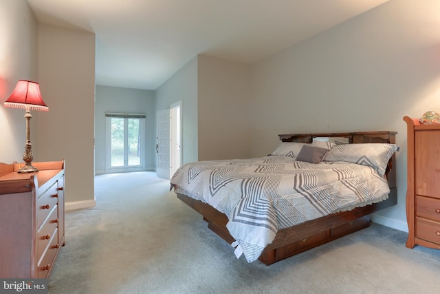 bedroom featuring light colored carpet