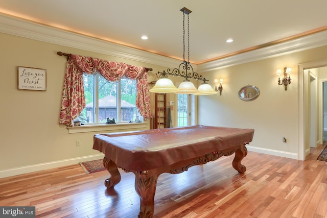 game room with ornamental molding, light hardwood / wood-style floors, and pool table