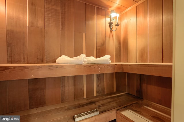 view of sauna / steam room featuring wood walls