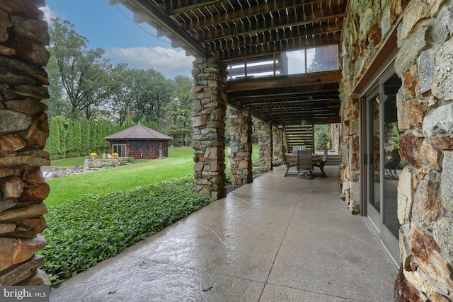 view of patio / terrace with an outdoor structure