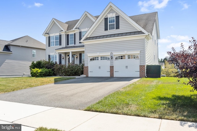 craftsman-style home with a front yard and a garage