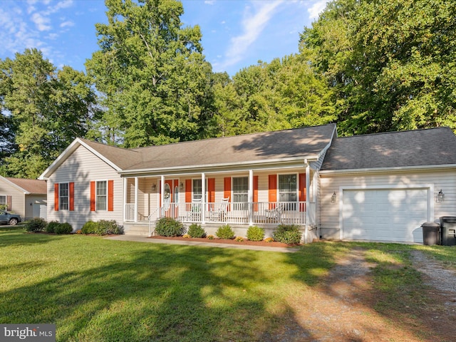 single story home featuring a porch, a front lawn, and a garage