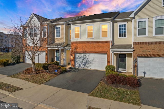 41930 Cushendall Ter, Aldie, VA 20105 - multi unit property with driveway, a garage, and brick siding