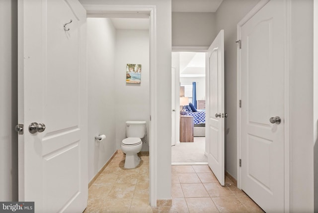 41930 Cushendall Ter, Aldie, VA 20105 - bathroom with toilet, baseboards, and tile patterned floors
