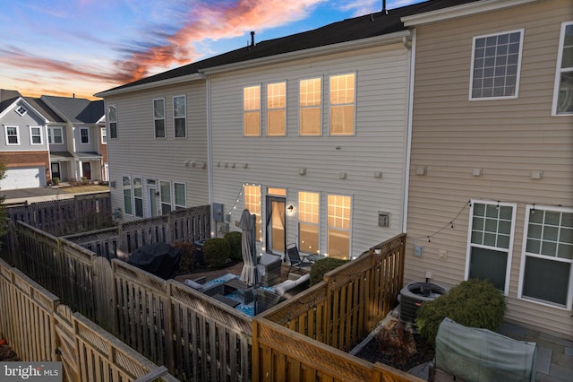 41930 Cushendall Ter, Aldie, VA 20105 - back of house with a fenced backyard and central AC