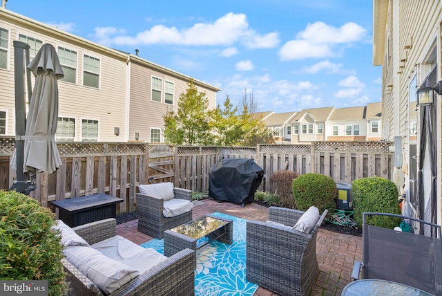 41930 Cushendall Ter, Aldie, VA 20105 - fenced backyard with grilling area, an outdoor living space, a residential view, and a patio