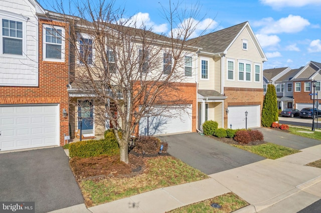 41930 Cushendall Ter, Aldie, VA 20105 - multi unit property with an attached garage, driveway, brick siding, and a residential view