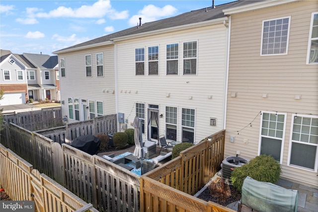 41930 Cushendall Ter, Aldie, VA 20105 - back of house with a fenced backyard and central AC unit
