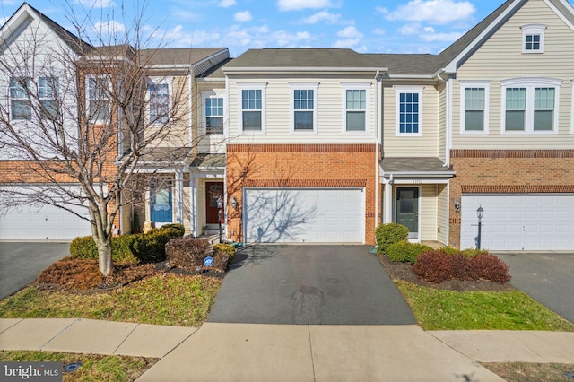 41930 Cushendall Ter, Aldie, VA 20105 - multi unit property featuring driveway, brick siding, and a garage