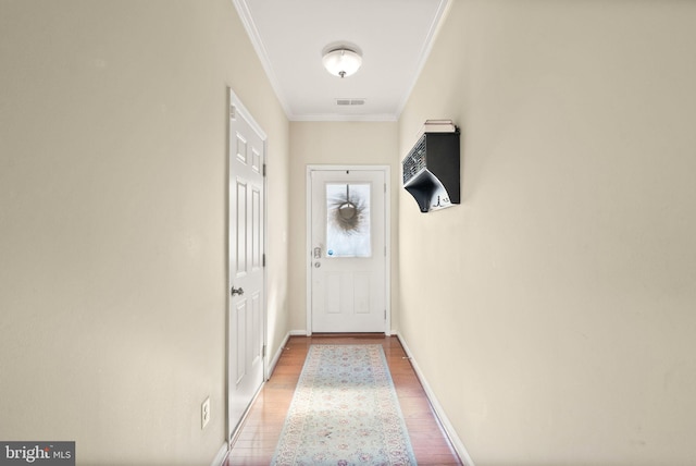 41930 Cushendall Ter, Aldie, VA 20105 - doorway to outside with ornamental molding, light wood-style flooring, and baseboards