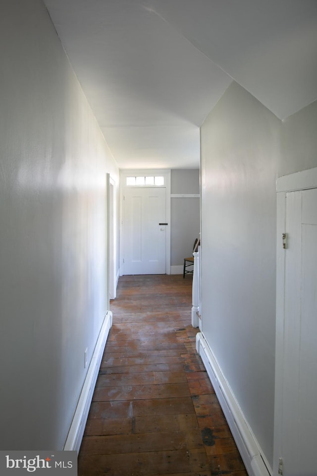 hall featuring dark wood-type flooring and a baseboard radiator