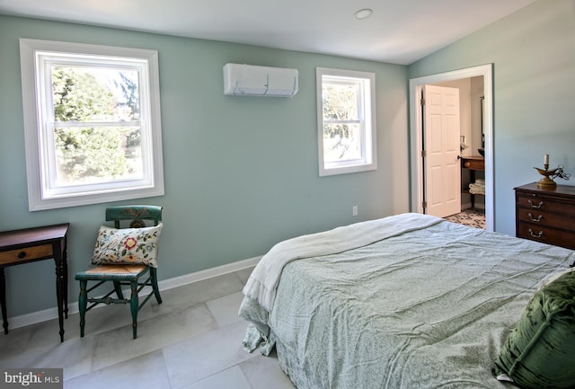 tiled bedroom with multiple windows, ensuite bath, an AC wall unit, and lofted ceiling