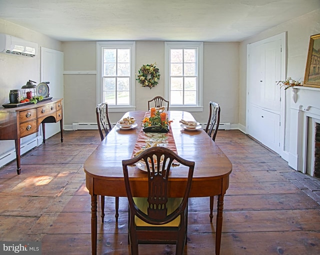 dining area with baseboard heating and a wall mounted air conditioner