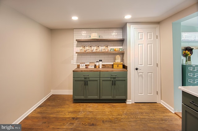 bar with decorative backsplash and wood-type flooring