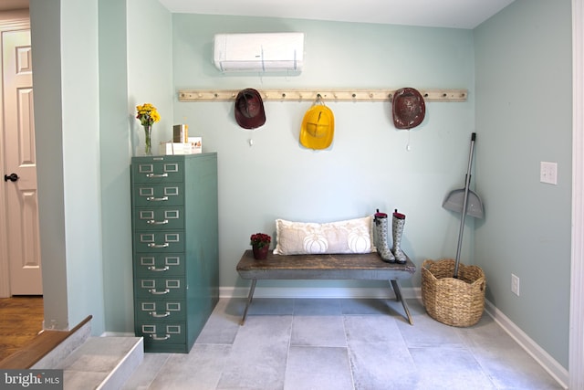 mudroom featuring a wall mounted AC