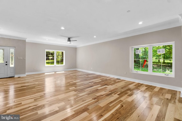 unfurnished living room featuring crown molding, ceiling fan, and light wood-type flooring