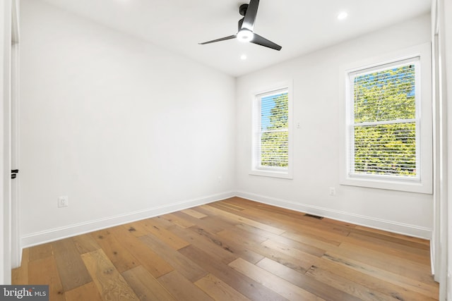 unfurnished room featuring ceiling fan and light hardwood / wood-style floors