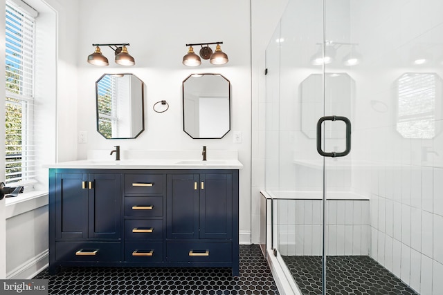 bathroom featuring vanity, tile patterned floors, and walk in shower