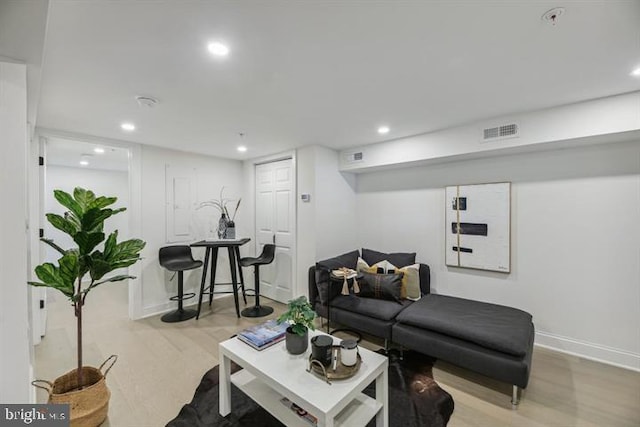 living room with light hardwood / wood-style floors