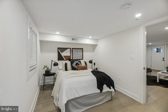 bedroom featuring hardwood / wood-style floors