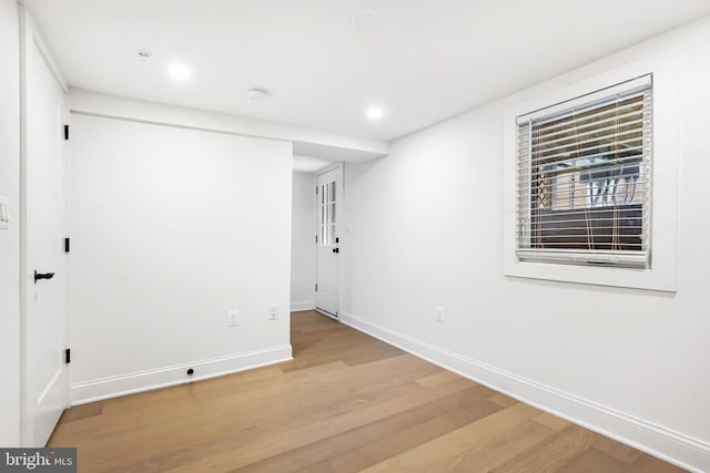 empty room with light hardwood / wood-style floors