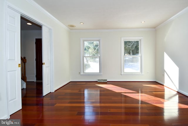 unfurnished room featuring dark hardwood / wood-style floors and crown molding