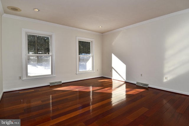 empty room with crown molding and dark hardwood / wood-style floors