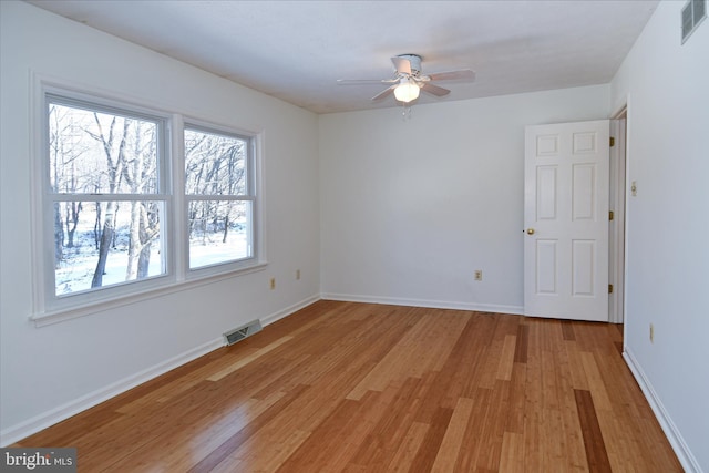 unfurnished room featuring ceiling fan and light hardwood / wood-style floors