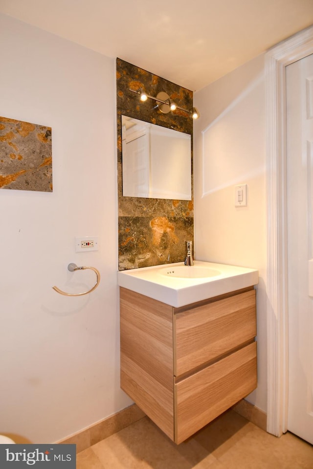 bathroom featuring backsplash and vanity