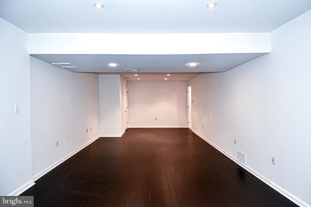 basement featuring dark hardwood / wood-style flooring