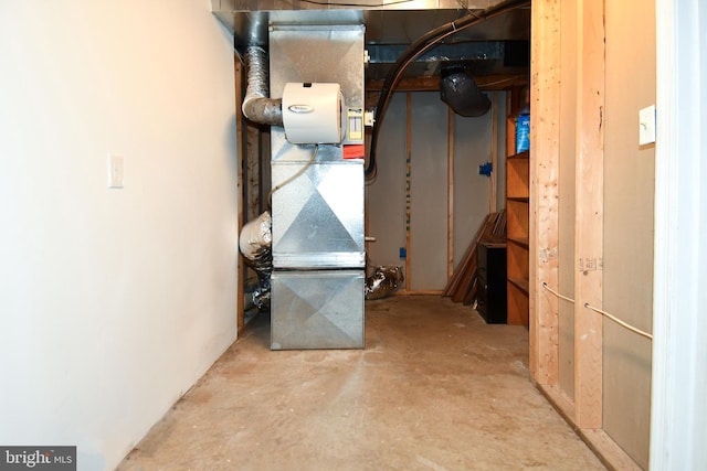 utility room featuring heating unit