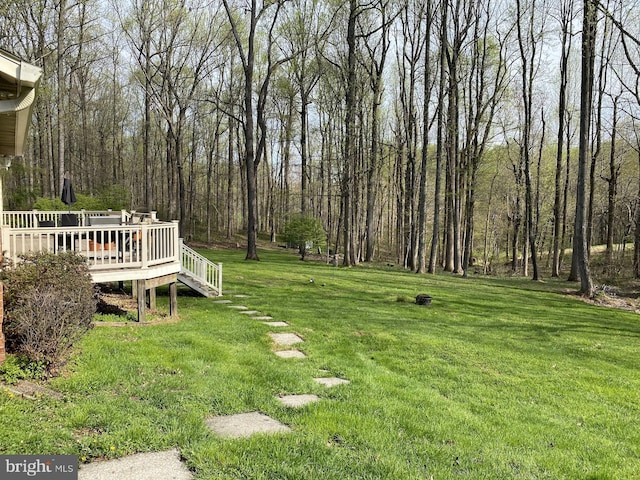 view of yard featuring a wooden deck