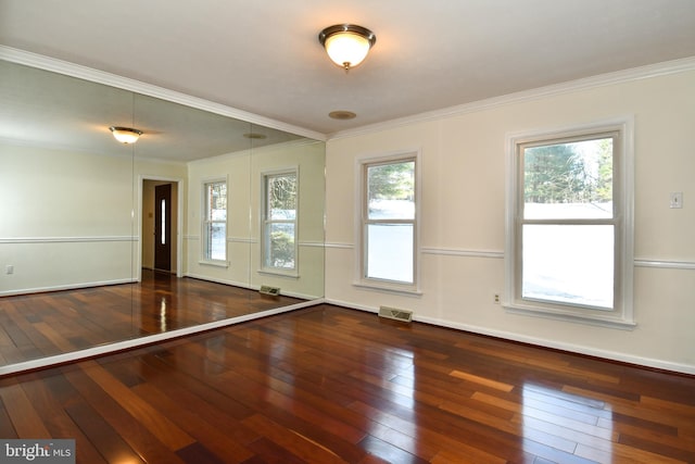 unfurnished room with dark hardwood / wood-style flooring and ornamental molding