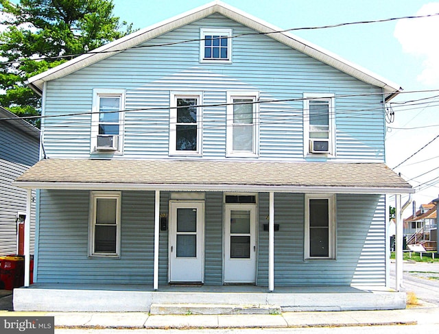 view of property with cooling unit and covered porch