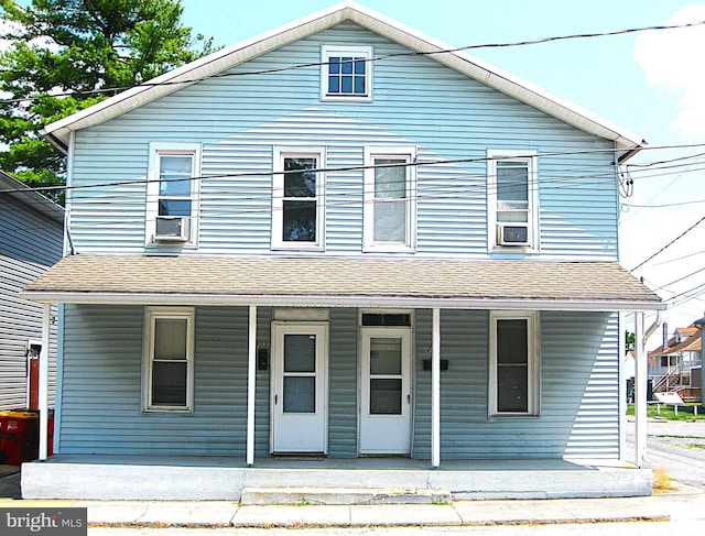 view of front of property with a porch and a shingled roof