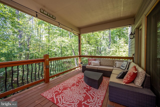 wooden deck featuring outdoor lounge area