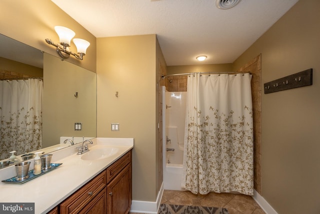 bathroom with shower / bathtub combination with curtain, tile patterned floors, a textured ceiling, and vanity