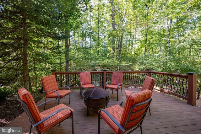 deck with an outdoor fire pit