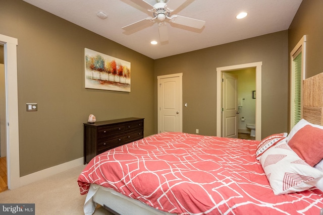 carpeted bedroom featuring connected bathroom and ceiling fan