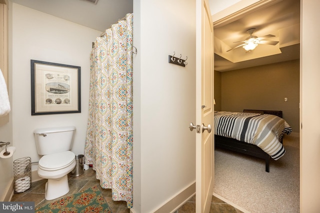 bathroom with ceiling fan, toilet, and tile patterned floors