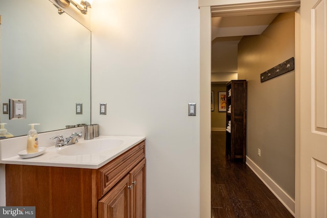 bathroom featuring wood-type flooring and vanity