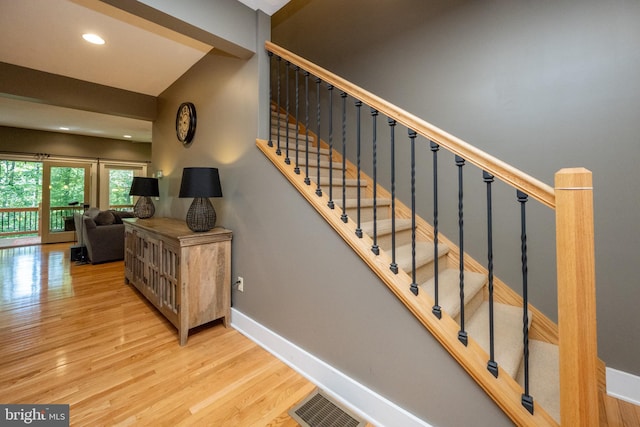 staircase featuring hardwood / wood-style floors