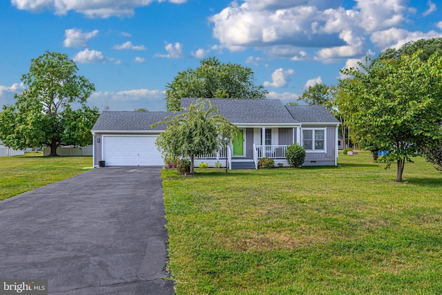 ranch-style home with a garage, a front yard, and a porch