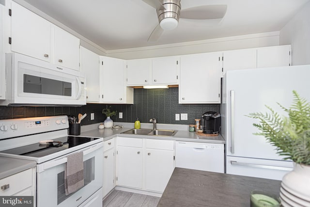 kitchen featuring white appliances, ceiling fan, white cabinetry, and sink