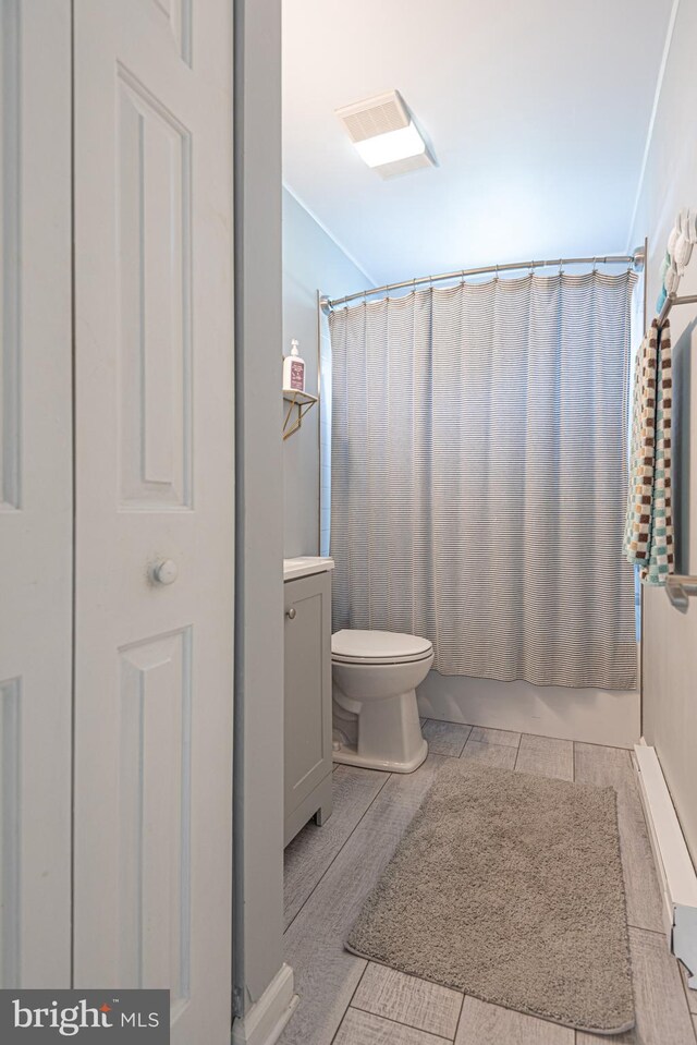 full bathroom with tile patterned flooring, vanity, toilet, and shower / bath combo