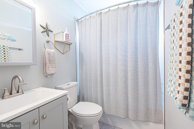 full bathroom featuring vanity, toilet, shower / tub combo with curtain, and tile patterned flooring