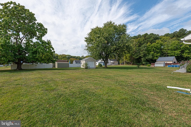 view of yard with an outbuilding and a garage