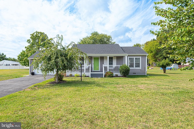 single story home featuring a front lawn and a porch